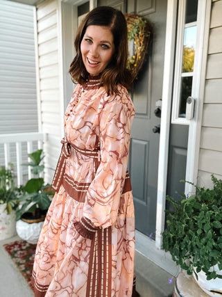 The Final Flourish boutique collection featuring romantic fall floral dresses and colorful chunky beaded statement necklaces.