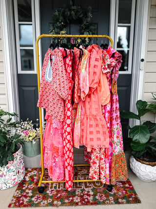 Meet Me There Collection featuring colorful boutique dresses in coral, pink, and floral prints for church, brunch, vacations, and everyday occasions.