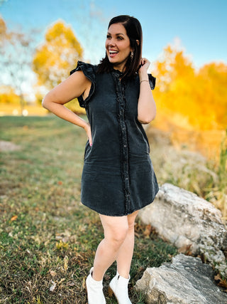 woman wearing a black mineral washed dress in a fall outdoor setting