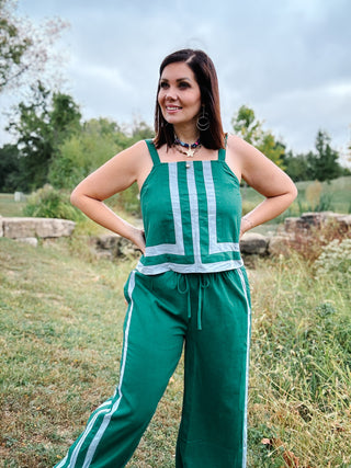 woman wearing Sporty Tank and Pants Set in a fall Green with Baby Blue Stripe Detail