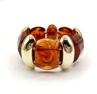 Bracelet with amber-colored beads and gold accents on a white background