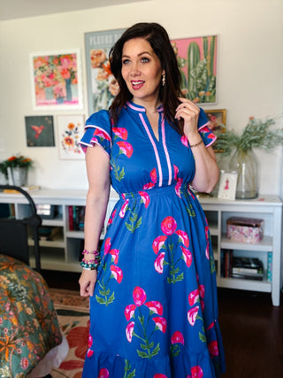 blue floral midi dress with pink trim and flutter sleeves