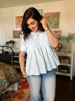 Baby blue lace yoke babydoll blouse with short sleeves and relaxed fit for spring