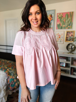 Baby pink lace yoke babydoll blouse with short sleeves and flowy fit for spring outfits