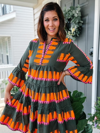 Ivy Jane Uncle Frank olive green jacquard tiered mini dress with orange and pink detailing, ruffled sleeves and pockets for women