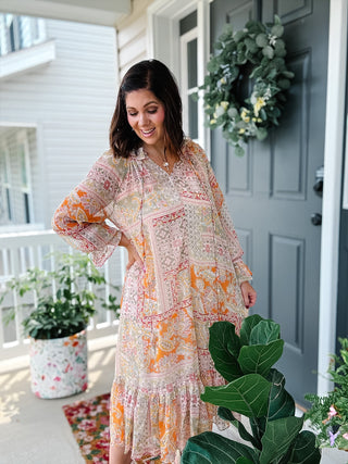 Karlie paisley chiffon ruffle midi dress in cream, blush, orange and sage, styled as a colorful fall wedding guest or family photo dress. Free People vibes