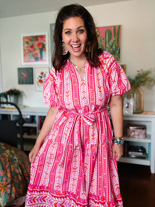 pink printed midi dress with puff sleeves and tie waist