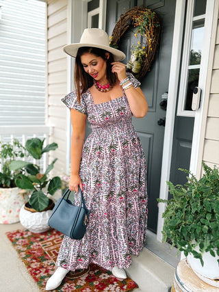Pink botanical block print cotton maxi dress with smocked bodice, square neckline and flutter sleeves