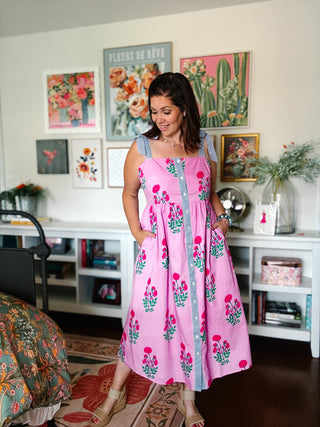 pink floral midi dress with bow tie straps and smocked back by THML