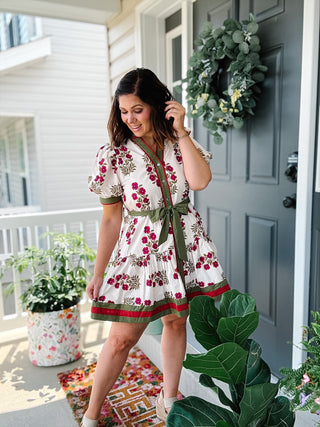 Veronica cream floral mini dress with berry red flowers, olive green trim, puff sleeves, tie waist and pockets for fall outfits